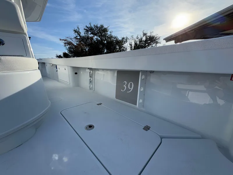 Slide: The Image of 2025 Yellowfin 39 Offshore boat deck under clear sky. - 55