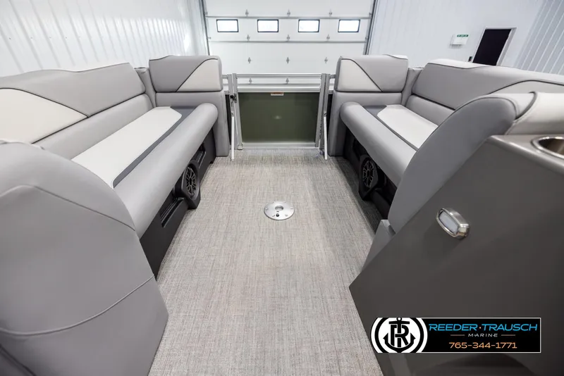 Slide: The Image of 2025 Avalon VEN QL interior with gray seating and carpeted flooring in a garage setting. - 18