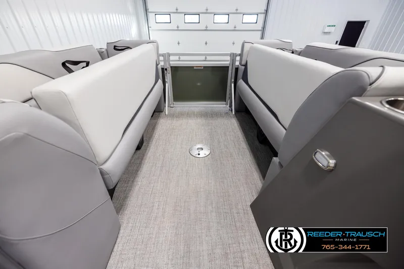 Slide: The Image of Interior of 2025 Avalon VEN QL boat with gray seating and carpeted flooring. - 19
