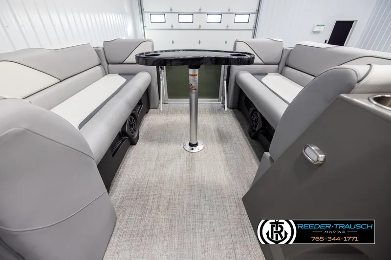 Slide: The Image of Interior of 2025 Avalon VEN QL pontoon boat with gray seating and central table. - 20