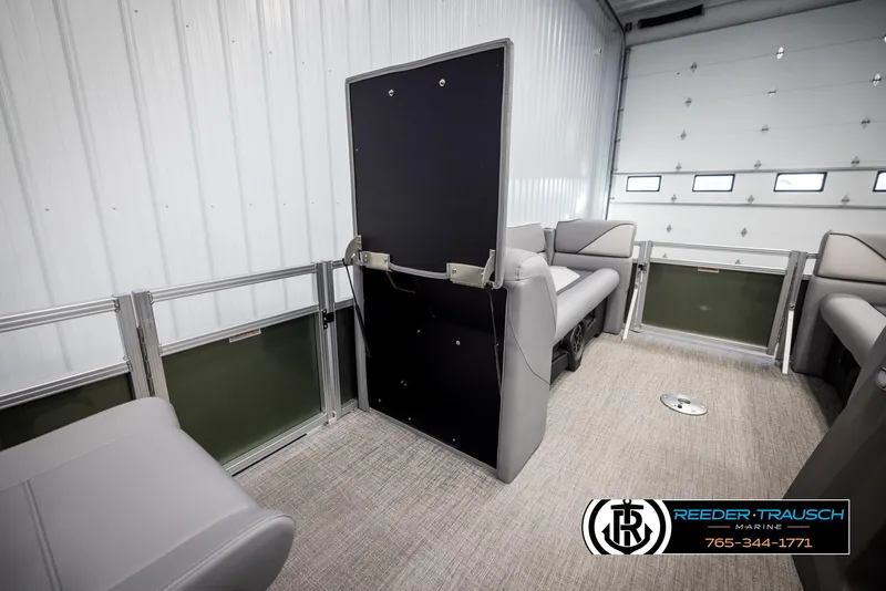 Slide: The Image of Interior of 2025 Avalon VEN QL boat with gray seating and carpeted floor. - 22