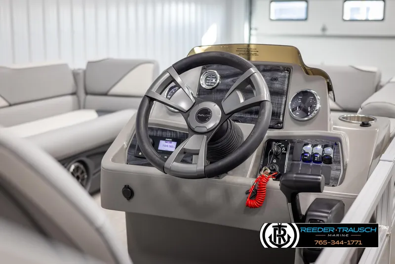 Slide: The Image of 2025 Avalon VEN QL boat interior with steering wheel and control panel. - 25