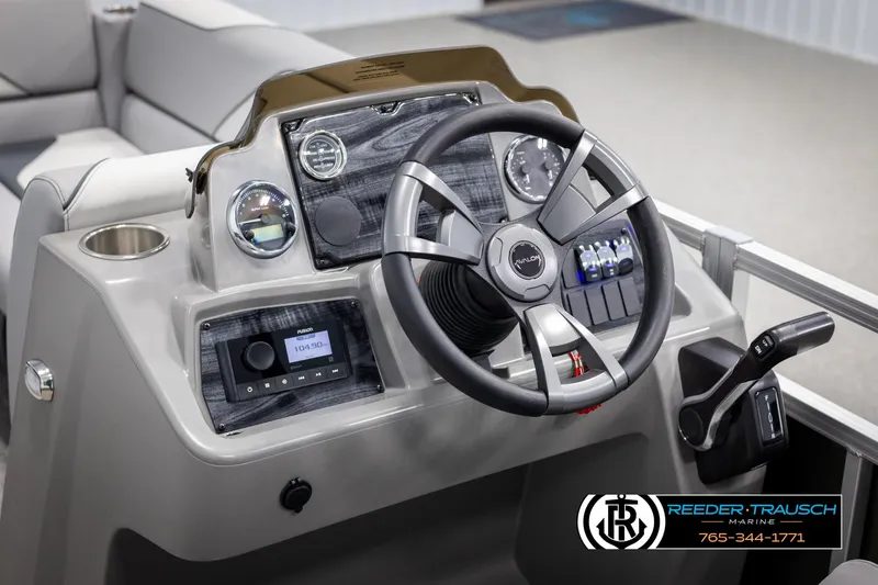 Slide: The Image of 2025 Avalon VEN QL boat dashboard with steering wheel and control panel. - 26
