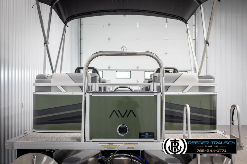 Slide: The Image of 2025 Avalon VEN QL pontoon boat in a showroom with canopy and seating. - 7