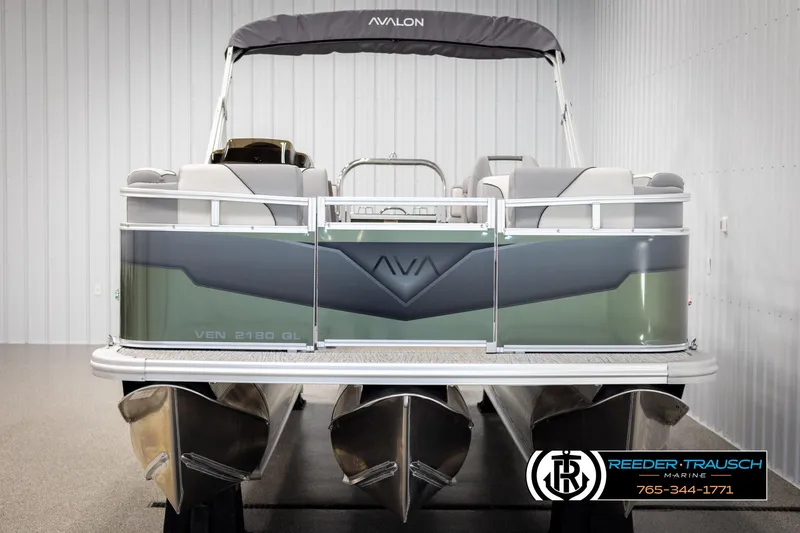 Slide: The Image of 2025 Avalon VEN QL pontoon boat in showroom, featuring sleek design and modern amenities. - 8