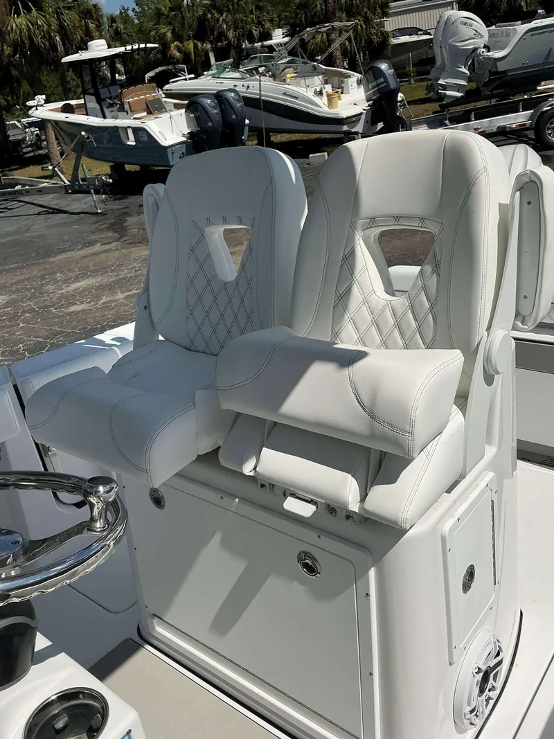 Slide: The Image of Luxurious white seating on 2025 Sportsman 262 Open boat, featuring diamond stitching and modern design. - 20