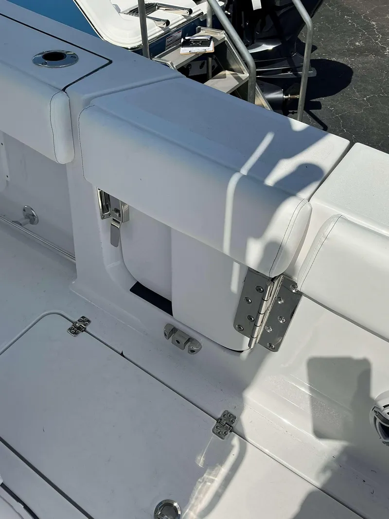 Slide: The Image of 2025 Sportsman 262 Open boat interior with white seating and stainless steel hinges. - 22