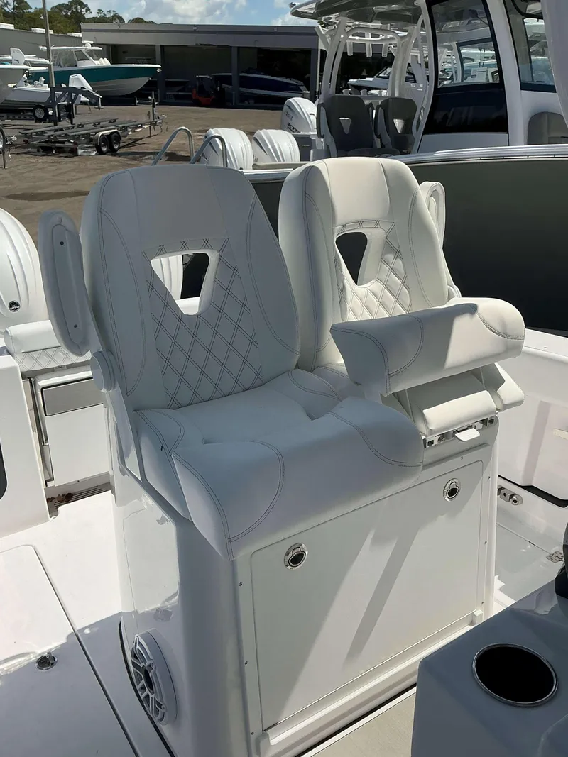 Slide: The Image of 2025 Sportsman 262 Open boat with luxurious white seating and modern design. - 8