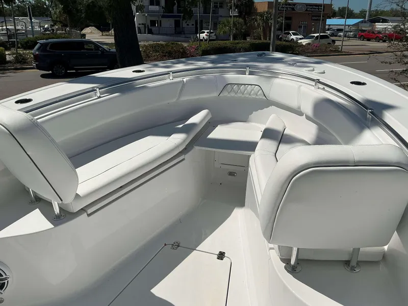 Slide: The Image of 2025 Sportsman 262 Open boat interior with white seating and spacious layout. - 9