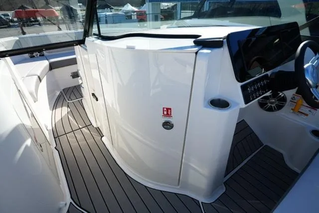 Slide: The Image of 2025 Sea Ray SDX 250 boat interior with sleek design and modern dashboard. - 12