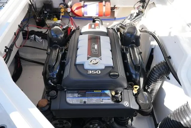 Slide: The Image of 2025 Sea Ray SDX 250 engine compartment with a 350 horsepower engine. - 18