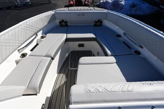 Slide: The Image of 2025 Sea Ray SDX 250 boat interior with white seating and sleek design. - 7