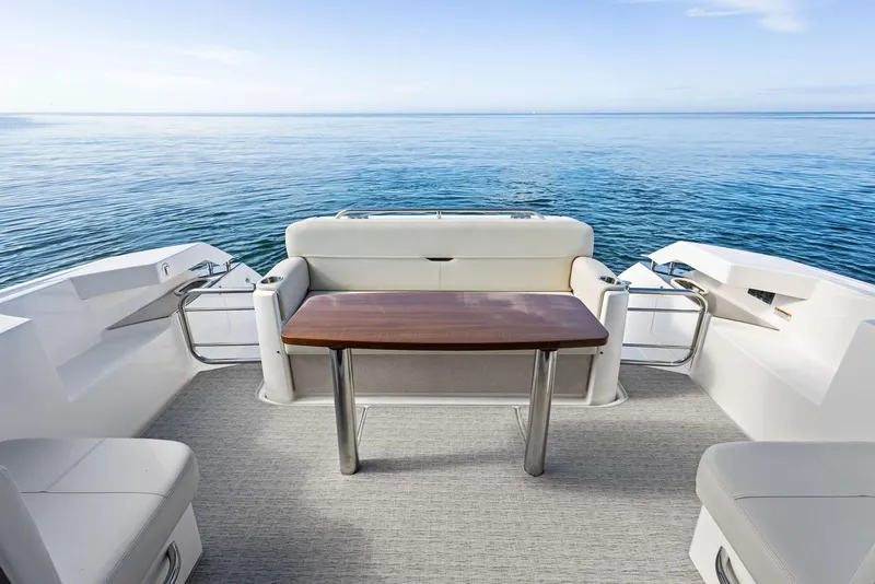Slide: The Image of 2019 Tiara Yachts 39 Coupe deck with seating and ocean view. - 20