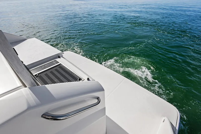 Slide: The Image of 2019 Tiara Yachts 39 Coupe, rear deck view on calm water. - 22