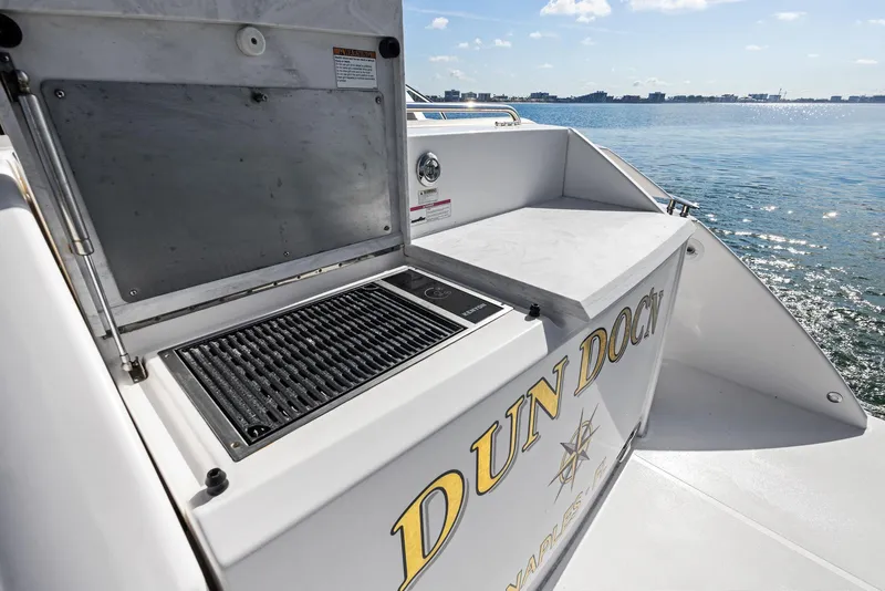 Slide: The Image of 2019 Tiara Yachts 39 Coupe with open grill on deck, ocean view. - 23