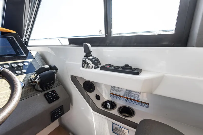 Slide: The Image of Control panel of a 2019 Tiara Yachts 39 Coupe, featuring modern navigation equipment. - 28