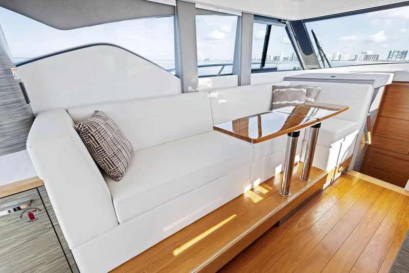 Slide: The Image of Luxurious interior of 2019 Tiara Yachts 39 Coupe with elegant seating and wooden table. - 29