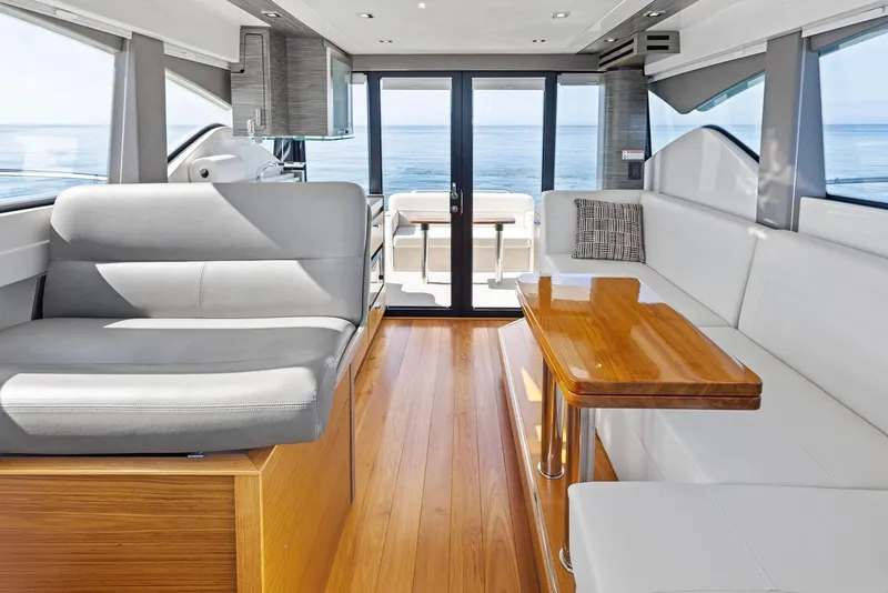 Slide: The Image of Interior of 2019 Tiara Yachts 39 Coupe with modern seating and ocean view. - 30