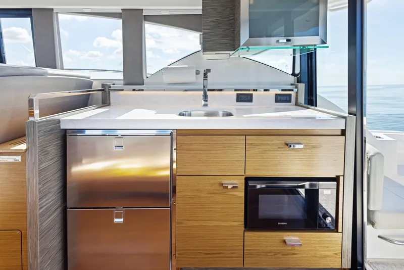 Slide: The Image of 2019 Tiara Yachts 39 Coupe kitchen with modern appliances and sleek design. - 32