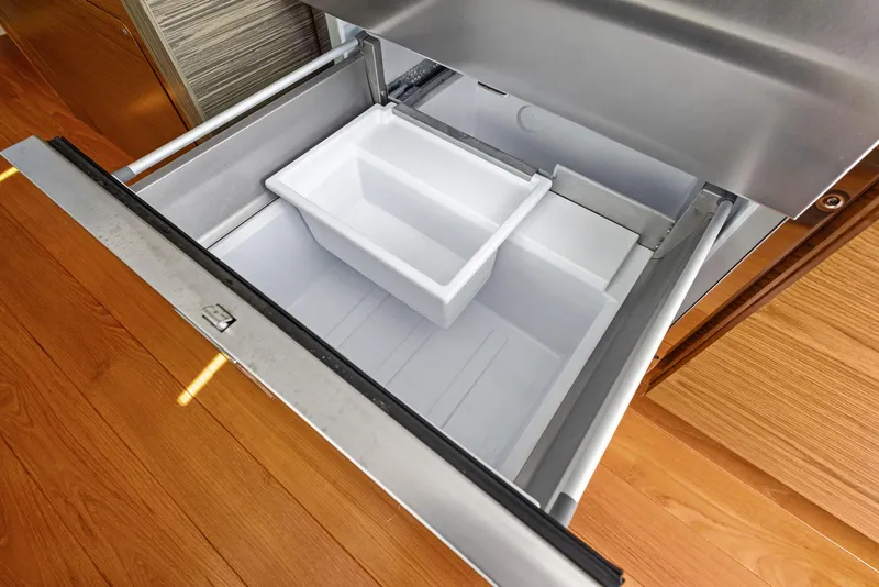 Slide: The Image of Open drawer refrigerator in 2019 Tiara Yachts 39 Coupe, featuring wooden flooring. - 34