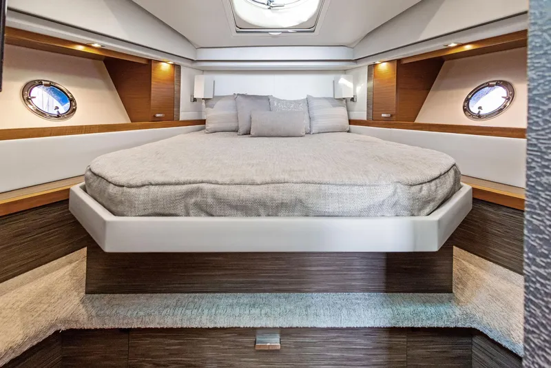 Slide: The Image of Luxurious interior of 2019 Tiara Yachts 39 Coupe with elegant bedding and ambient lighting. - 37