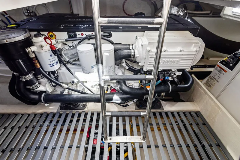 Slide: The Image of Engine compartment of a 2019 Tiara Yachts 39 Coupe, featuring detailed mechanical components. - 48