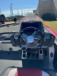 Slide: The Image of 2023 Ranger Z520R boat dashboard with steering wheel and control panel. - 6