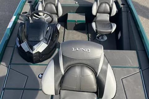 Slide: The Image of 2025 Lund 1875 Renegade SS boat interior with steering console and seating. - 11