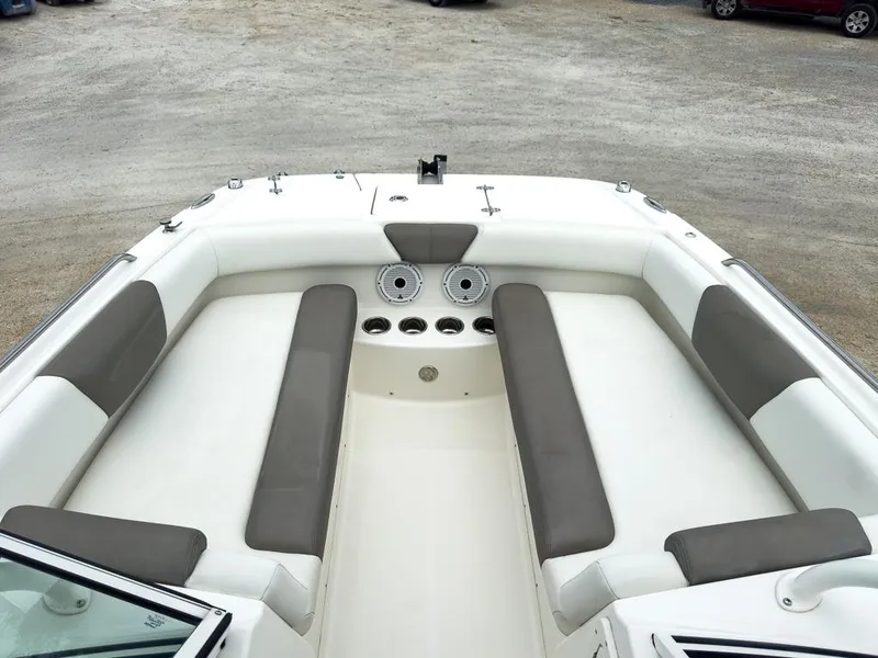 Slide: The Image of 2022 World Cat 230 SD boat interior with spacious seating and cup holders. - 10