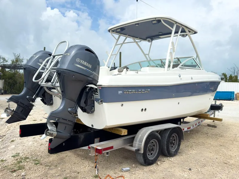 Slide: The Image of 2022 World Cat 230 SD boat on trailer with twin Yamaha outboard engines. - 4