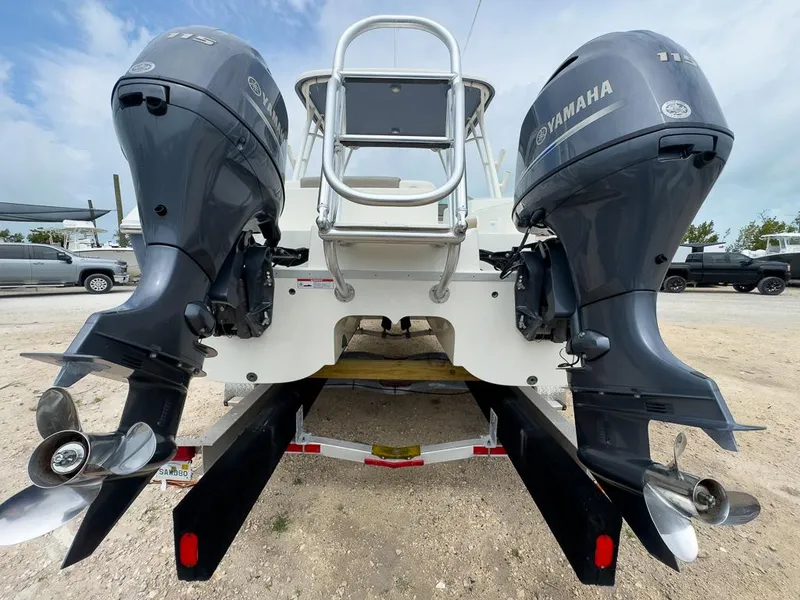 Slide: The Image of 2022 World Cat 230 SD boat with dual Yamaha outboard engines, rear view. - 5