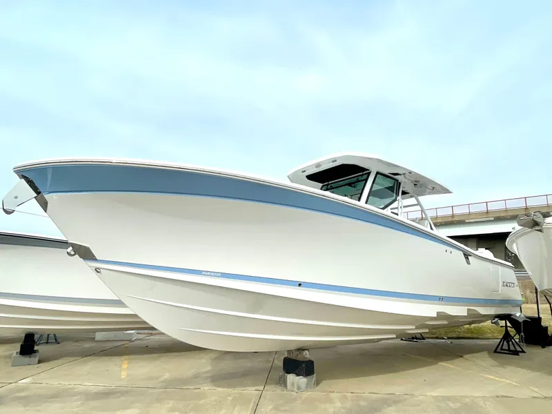 Slide: The Image of 2022 Blackfin 332 CC boat on display, showcasing sleek design and modern features. - 14