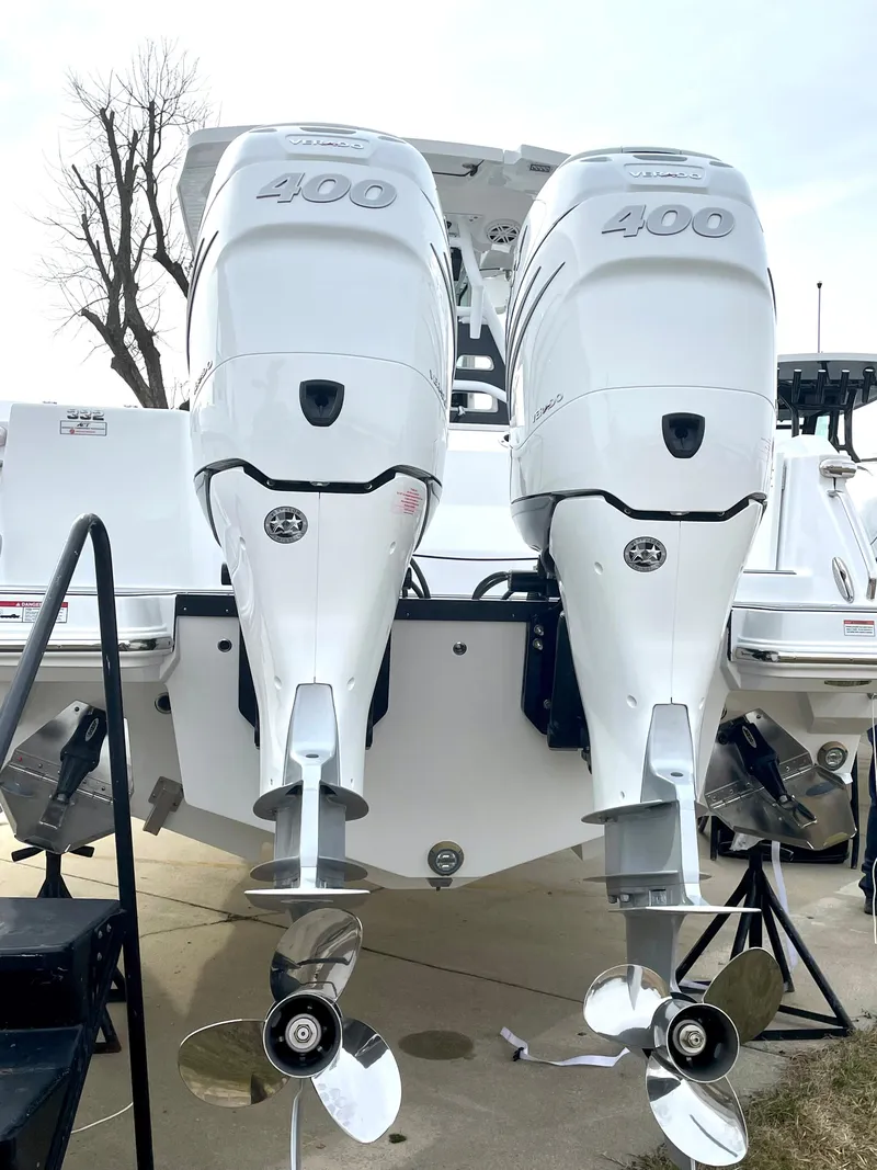 Slide: The Image of 2022 Blackfin 332 CC boat with dual 400 horsepower outboard engines, rear view. - 16