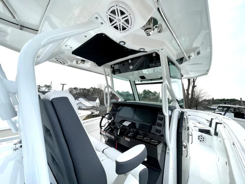 Slide: The Image of 2022 Blackfin 332 CC boat cockpit with modern controls and seating. - 19