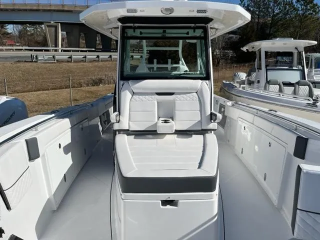 Slide: The Image of 2022 Blackfin 332 CC boat with spacious seating and modern design. - 22