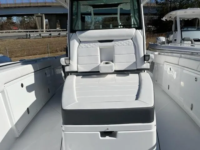 Slide: The Image of 2022 Blackfin 332 CC boat interior with white seating and modern design. - 23