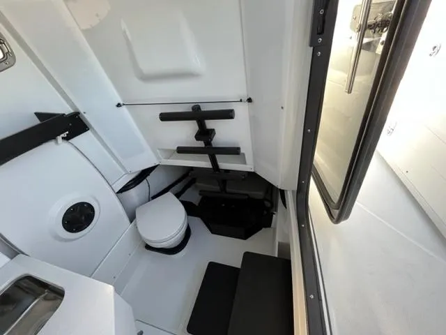 Slide: The Image of 2022 Blackfin 332 CC boat interior with compact bathroom and modern fixtures. - 28