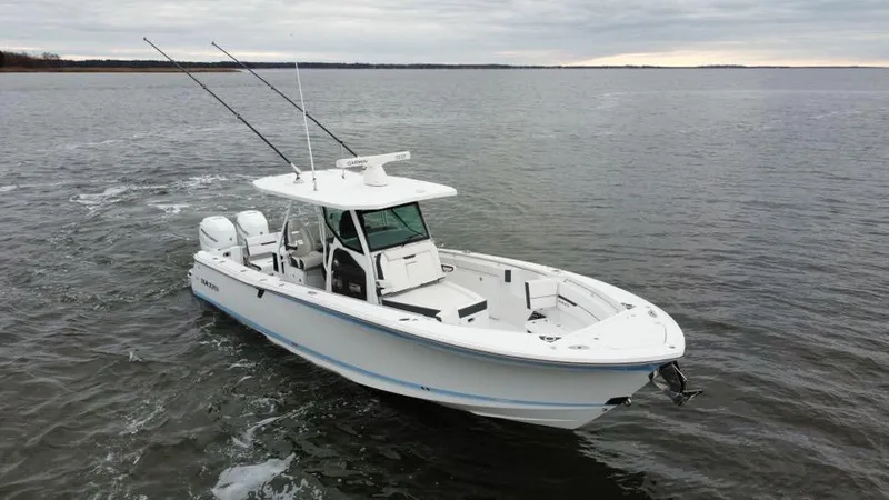 Slide: The Image of 2022 Blackfin 332 CC boat cruising on open water. - 3