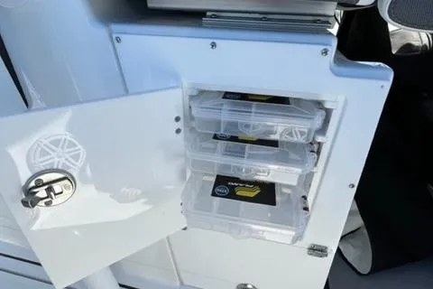 Slide: The Image of Storage compartment with tackle boxes on a 2022 Blackfin 332 CC boat. - 33