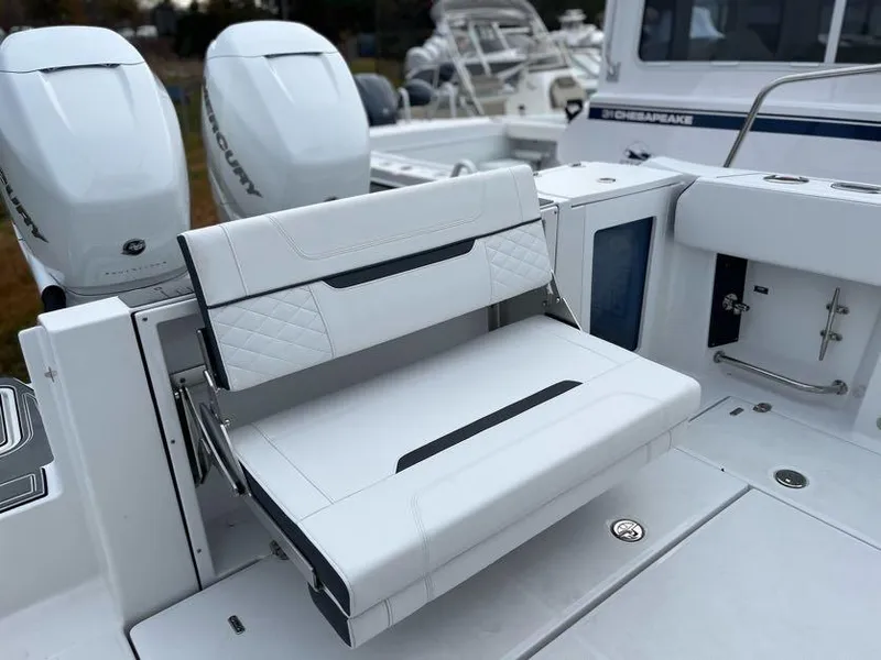 Slide: The Image of 2022 Blackfin 332 CC boat with white seating and dual Mercury outboard engines. - 5