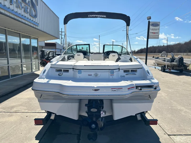 Slide: The Image of 2025 Chaparral 21 SSi Ski & Fish boat, rear view, parked outdoors. - 3