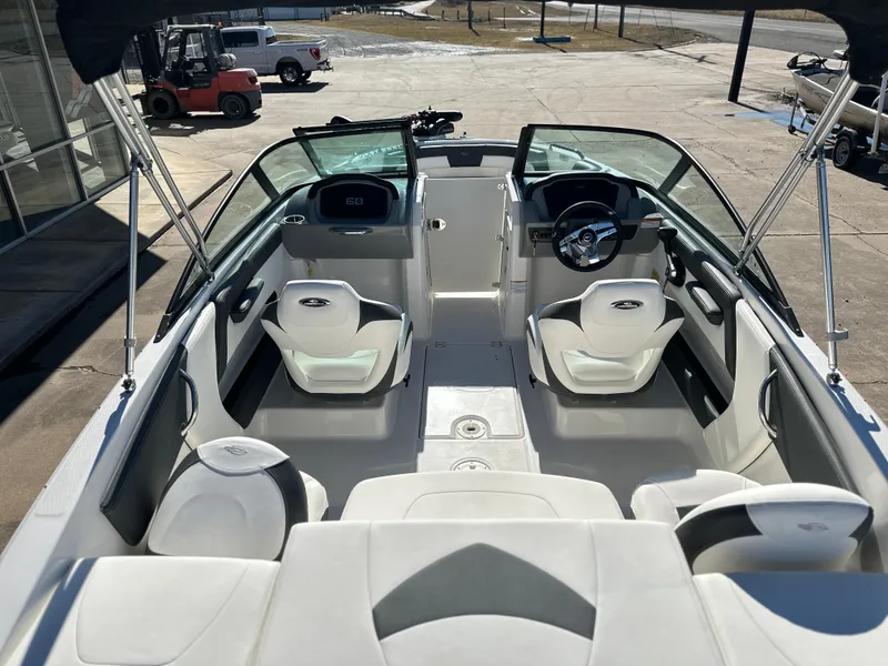 Slide: The Image of 2025 Chaparral 21 SSi Ski & Fish boat interior with seating and steering wheel. - 4