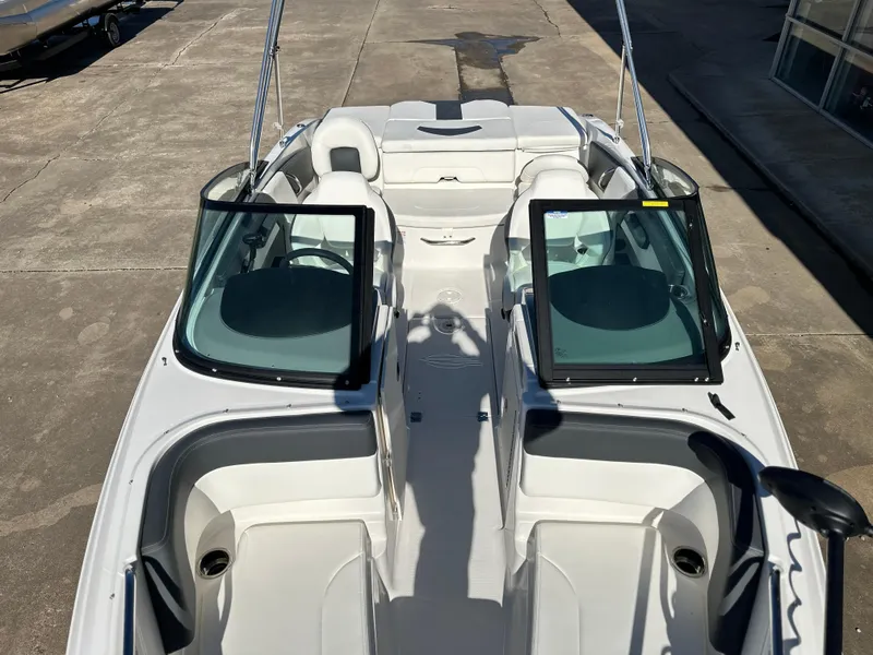 Slide: The Image of 2025 Chaparral 21 SSi Ski & Fish boat interior, featuring dual consoles and seating. - 7