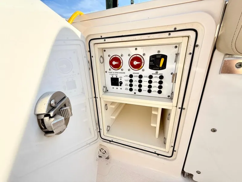 Slide: The Image of Control panel of a 2016 Pursuit S 280 Sport boat, featuring switches and dials. - 22