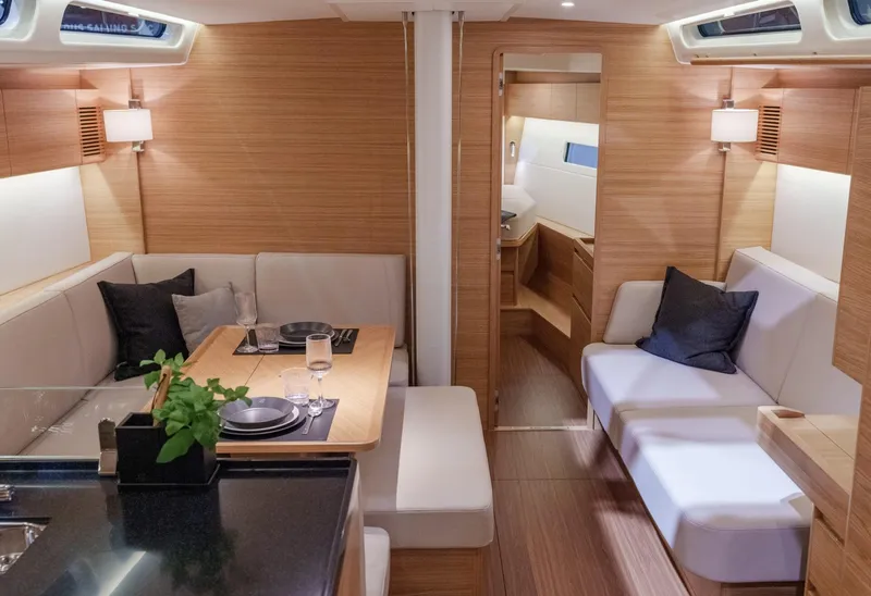 Slide: The Image of Luxurious interior of 2026 X-Yachts X4 9, featuring elegant wood finishes and modern seating. - 10
