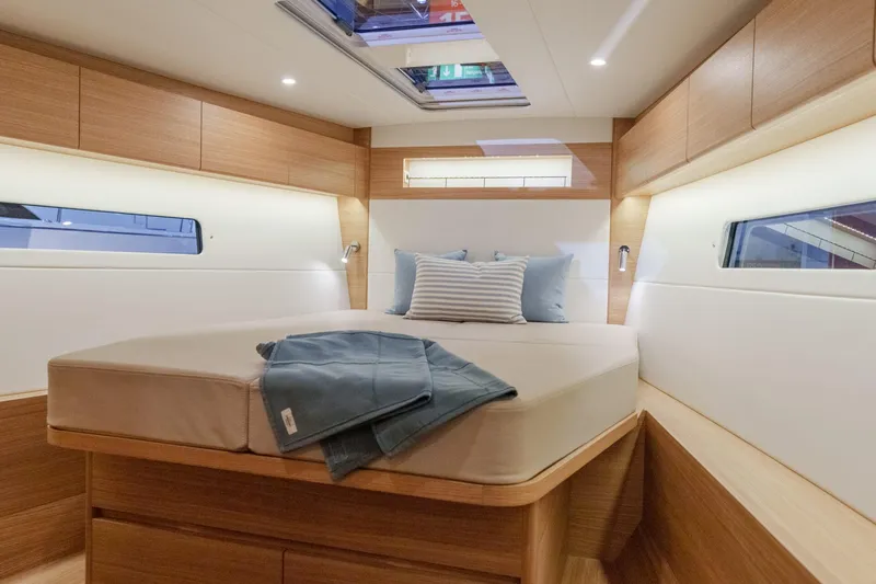 Slide: The Image of Luxurious cabin interior of 2026 X-Yachts X4 9, featuring a cozy bed and modern design. - 7