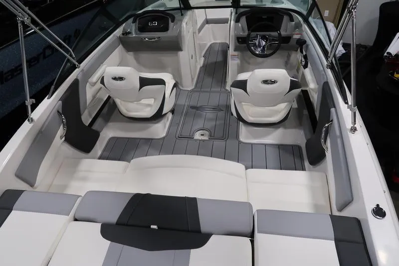 Slide: The Image of 2025 Chaparral 21 SSi boat interior with modern seating and sleek design. - 14