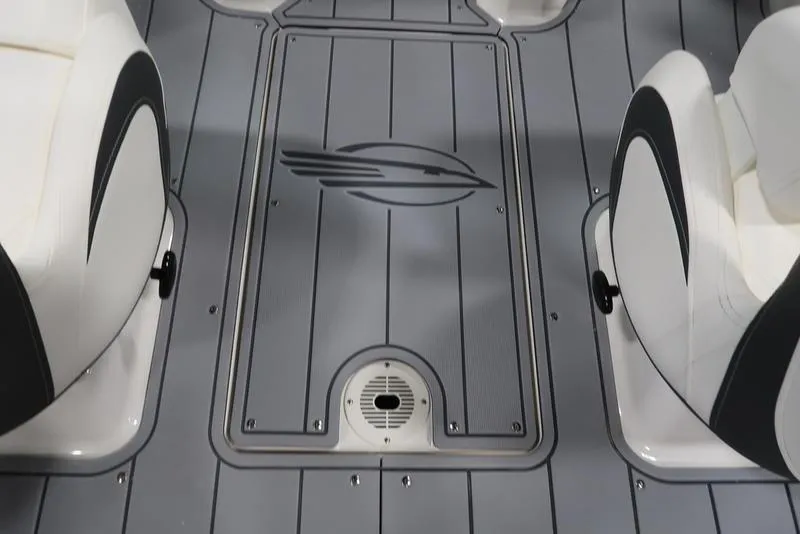 Slide: The Image of Interior view of 2025 Chaparral 21 SSi boat, featuring sleek seating and flooring design. - 19