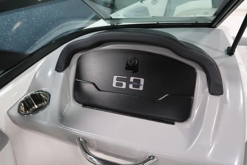 Slide: The Image of Dashboard of 2025 Chaparral 21 SSi boat with storage compartment and handle. - 25