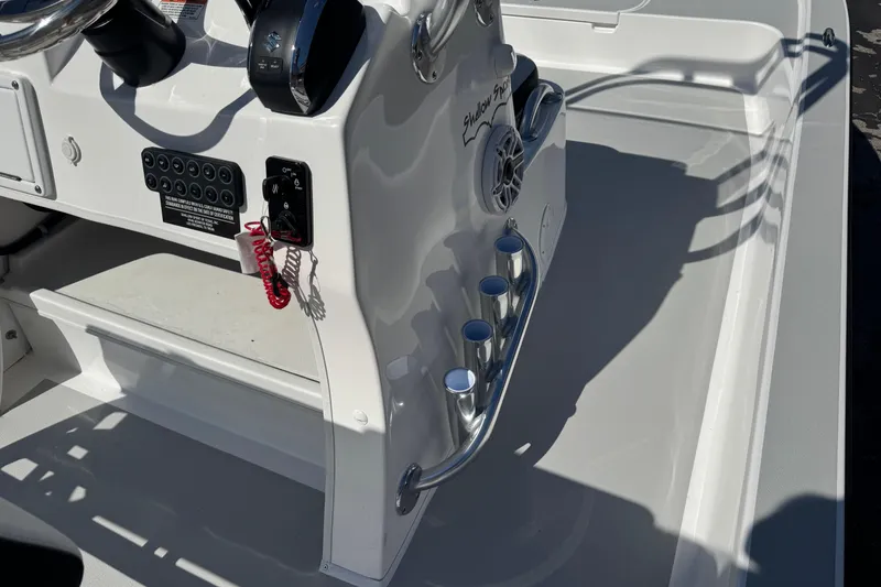 Slide: The Image of Shallow Sport 22 Sport 2026 boat console with controls and cup holders. - 11